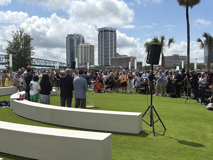 A crowd looks on as city leaders speak during the May 13 ribbon-cutting ceremony for Riverfront Music Garden park, adjacent to the Jacksonville Center for the Performing Arts.
