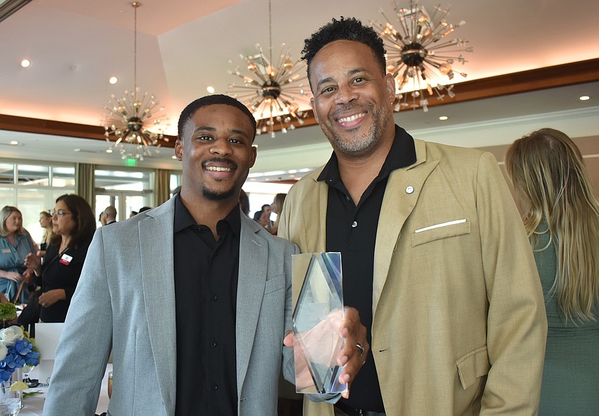 Tre Alexandrea, the chief operations officer of Aginto and head basketball coach at Bayshore High School, is joined by his father, Gregory Alexandrea, at the YLA Next Gen Awards where he won the 