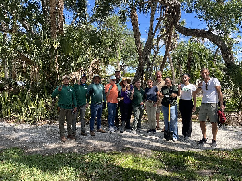 A team including students from the University of South Florida Sarasota-Manatee gather during work on the project.