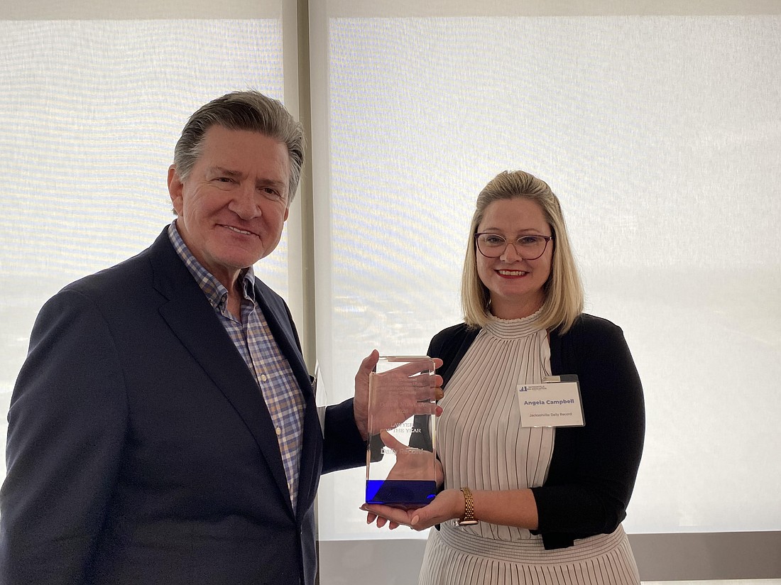 Daniel Nunn Jr., 2026 Jacksonville Daily Record Lawyer of the Year, and Jacksonville Daily Record Publisher Angie Campbell.