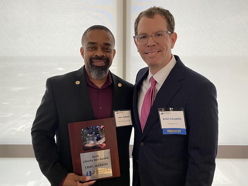 Leon Jackson, senior manager of jury services with the Duval County Clerk of Courts, accepted the 2026 Liberty Bell Award from Jacksonville Bar Association President Brian Coughlin.