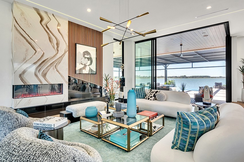 High ceilings and glass walls fill the living area with natural light. High ceilings and glass walls fill the living area with natural light.