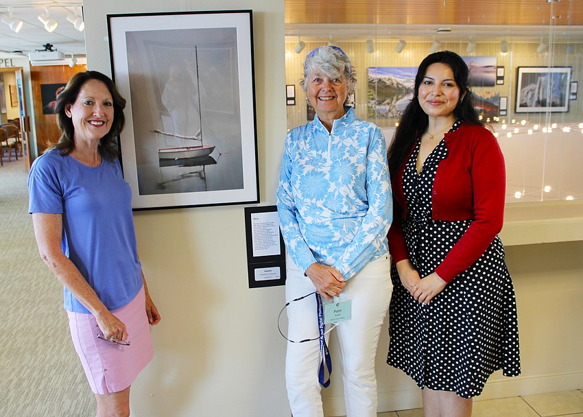During a pre-reception tour of the new gallery of local photographers hosted by Plymouth Harbour, Lynnette Beecher, Pam Truitt and Sasha Madrid explained how they aimed to feature a variety of styles from new and experienced photographers.