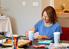 Debby Debile joins fellow Longboaters in enjoying a relaxing afternoon at The Paradise Center, where a summer kick-off event featured tea and coloring.