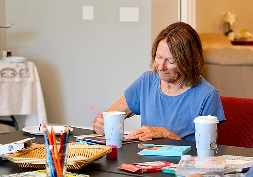 Debby Debile joins fellow Longboaters in enjoying a relaxing afternoon at The Paradise Center, where a summer kick-off event featured tea and coloring.