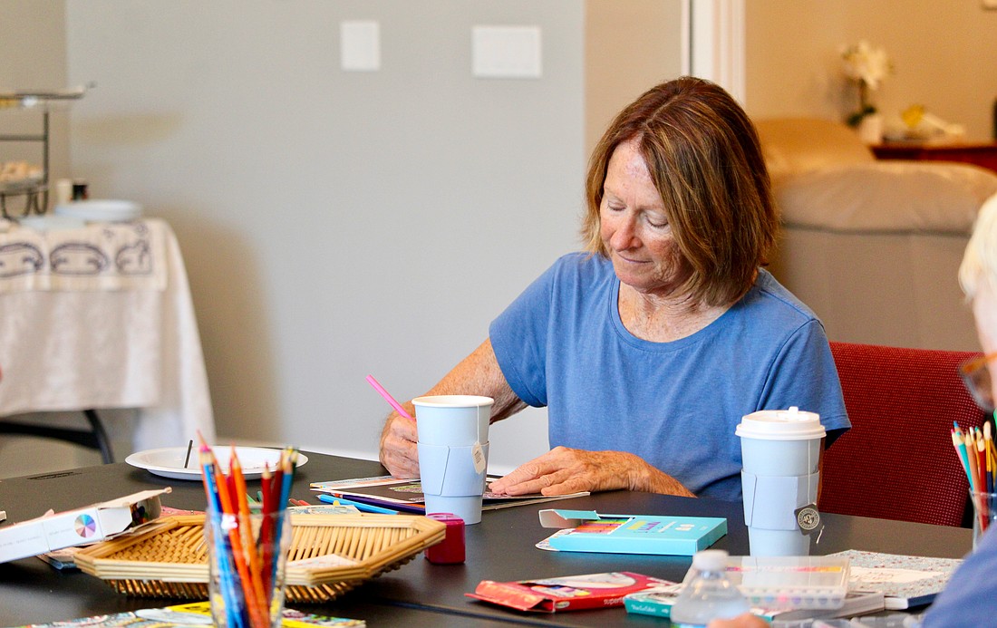 Debby Debile joins fellow Longboaters in enjoying a relaxing afternoon at The Paradise Center, where a summer kick-off event featured tea and coloring.