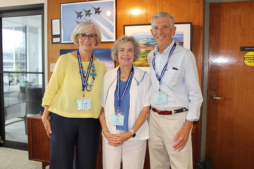 Barbara Miciak, Lois Mauro and Art Newman, members of the Lakewood Ranch Digital Photography Club, stand by their pieces capturing aviation scenes at the Plymouth Harbor showcase.