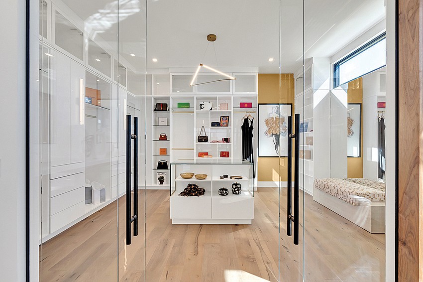 The primary closet takes inspiration from a designer boutique. The primary closet takes inspiration from a designer boutique.
