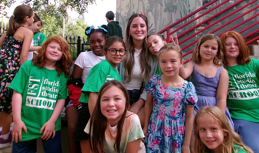 Campers and teaching artists gather outside Florida Studio Theatre as part of the organization’s Summer Camp program.