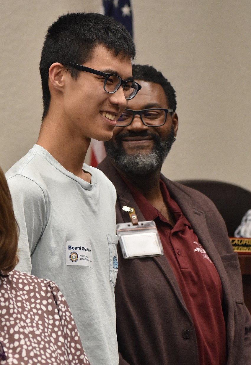 Braden River High School senior Kevin Chen was joined by his principal Wendell Butler when he was recognized by the school board on March 10.