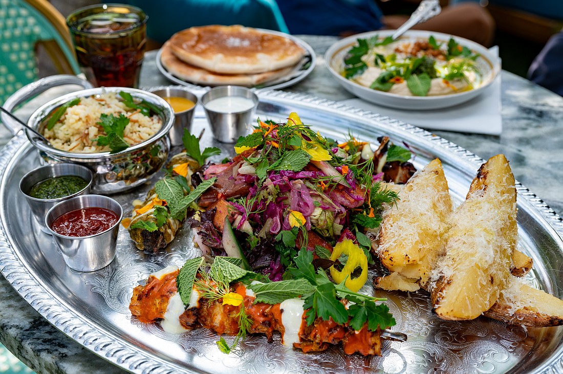 A colorful spread of kebabs, house-made sauces and sides showcases the restaurant’s bold, cross-cultural approach to Mediterranean cuisine.