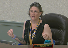 School Board Member Heather Felton took off her blazer during the May 5 workshop to show her sleeveless shirt is appropriate for students in the Florida heat.