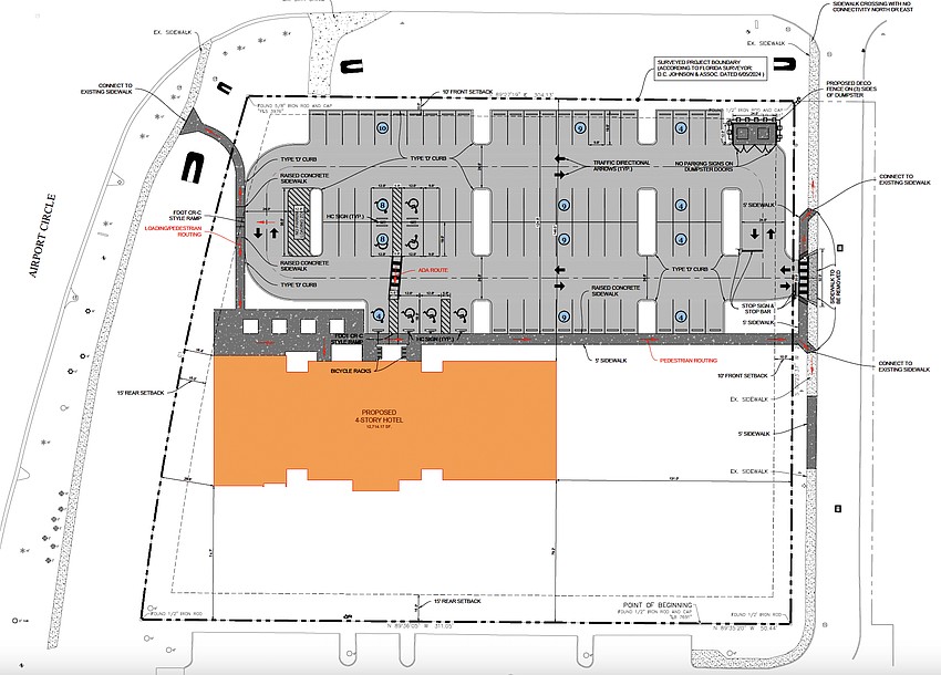 The site plan for the Kompose Hotel shows the four-story building in orange, the parking lot at the top and amenity space covering the remainder of the parcel The site plan for the Kompose Hotel shows the four-story building in orange, the parking lot at the top and amenity space covering the remainder of the parcel