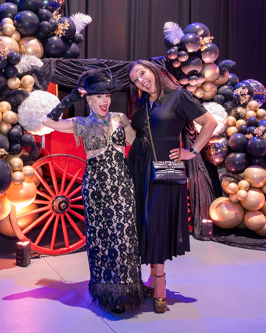 Co-Chair Lauren Walsh, with Circus Arts President and CEO Jennifer Mitchell, poses in front of the circus's carriage photo op.