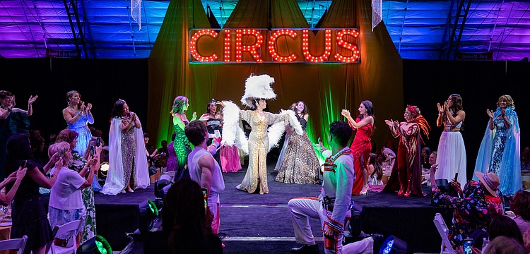 CAC Co Founder Dolly Jacobs and all the models gather on the stage for the fashion show finale.