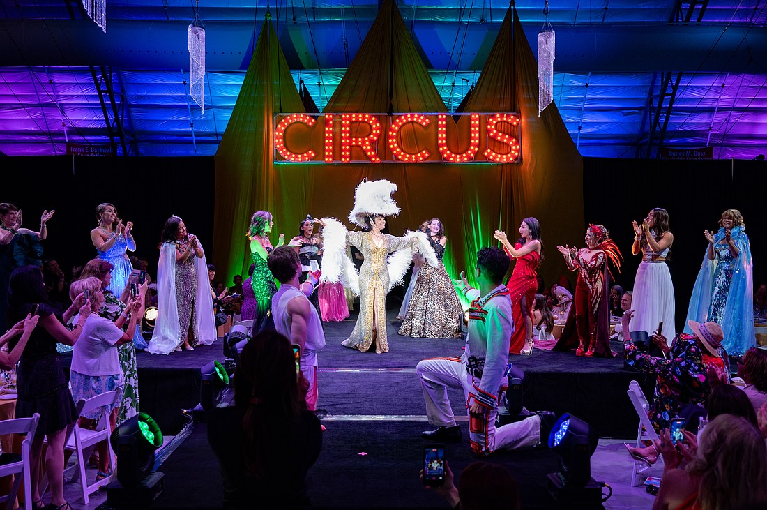 CAC Co Founder Dolly Jacobs and all the models gather on the stage for the fashion show finale.