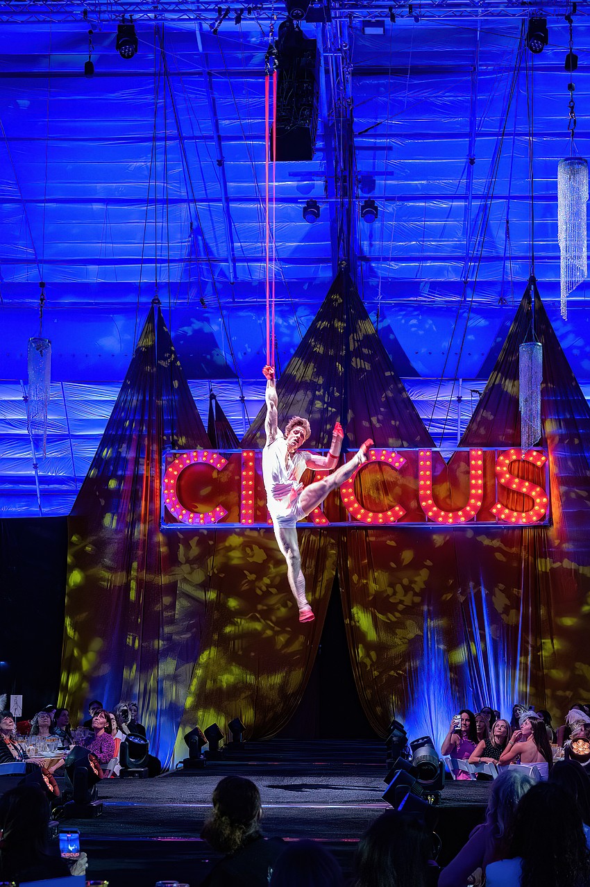 Cirque artist Noel Aguilar performs at the Cirque Vogue luncheon.