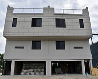 Each townhome features a two-car garage and a rooftop terrace.