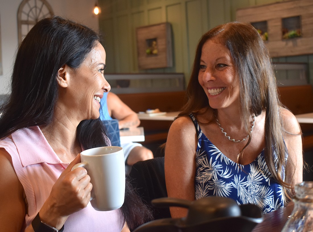 Nevriye Yesil, the founder of the Lakewood Ranch Happiness Circle, is glad to share her wisdom with friends and strangers alike, including Lisa Lieberman-Wang.