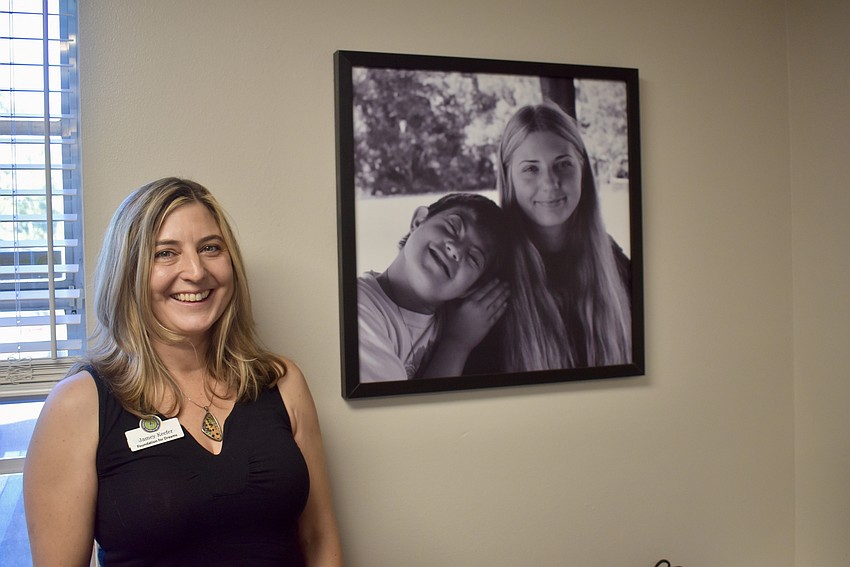 Jamey Keefer, the community advocate for Foundation for Dreams, has a picture of her children, Lucas and Hannah, in her office. Lucas Keefer attended camp last summer, but will be too old for the program this summer.