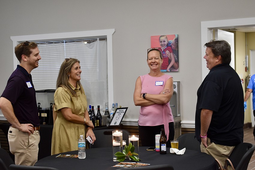 Nonprofit leaders chat at the reception May 14. From left to right: Mac Schmitz and Yolanda Mancha with the Manatee Community Foundation, Nicole Murby with Easter Seals and Chris Collins with Ability to Include.