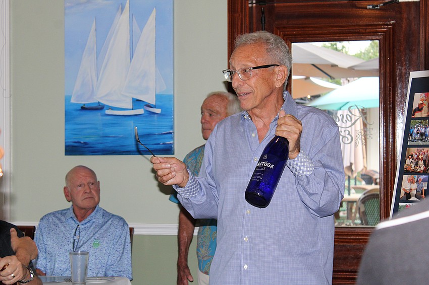 Larry Panza gives a toast at friend Harold Goldstein's 100th birthday party.