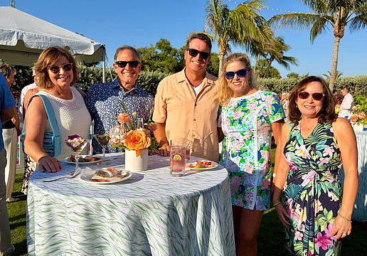 Karen and Gregg Sweeney, Chris and Cathy Goglia, and Debbie McPeak socialize at the Longboat Key Club's farewell lawn party on May 15.