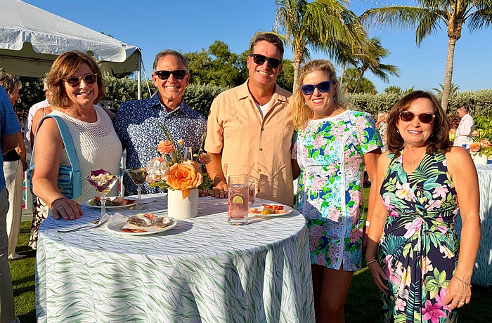 Karen and Gregg Sweeney, Chris and Cathy Goglia, and Debbie McPeak socialize at the Longboat Key Club's farewell lawn party on May 15.