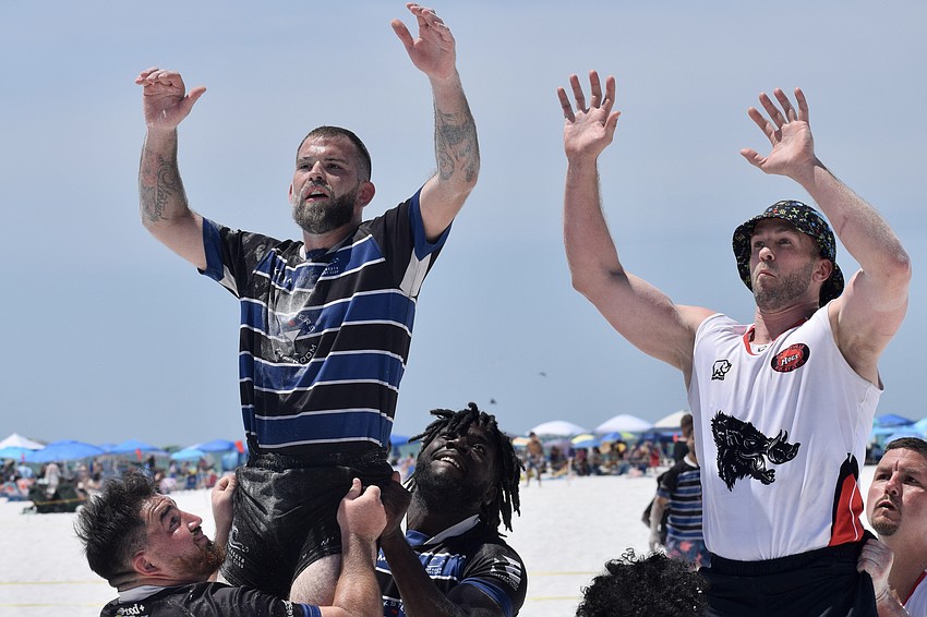 Julian Cupo (left) and Lashawn Bowman (third from left) lift Chris Marrero (second from left) in a lineout for the Sarasota Surge. Per club president Gary Jones, rugby has been in Sarasota since the late 1990s. Julian Cupo (left) and Lashawn Bowman (third from left) lift Chris Marrero (second from left) in a lineout for the Sarasota Surge. Per club president Gary Jones, rugby has been in Sarasota since the late 1990s.