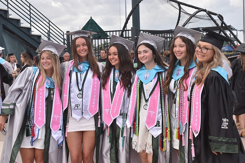 Madeline Vitale, Savanna Chumbley, Elizabeth Sponsel, Samantha Devine, Andrea Toro Colon and Hayden Zimmerman graduate as members of Girls in White Coats.