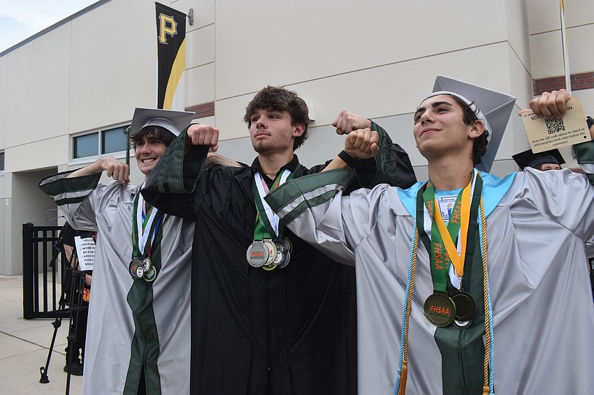 Brennen Sidnam, Trey Rowland and Ethan Ruben, who medalled in the regional competition for weightlifting, flex on their high school years.