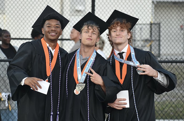 Daniel Sanchez, Christopher Schrum and Griffin Shay head onto the field.