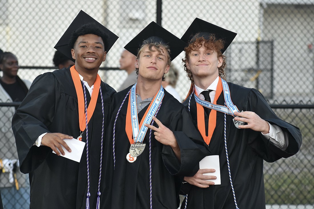 Daniel Sanchez, Christopher Schrum and Griffin Shay head onto the field.