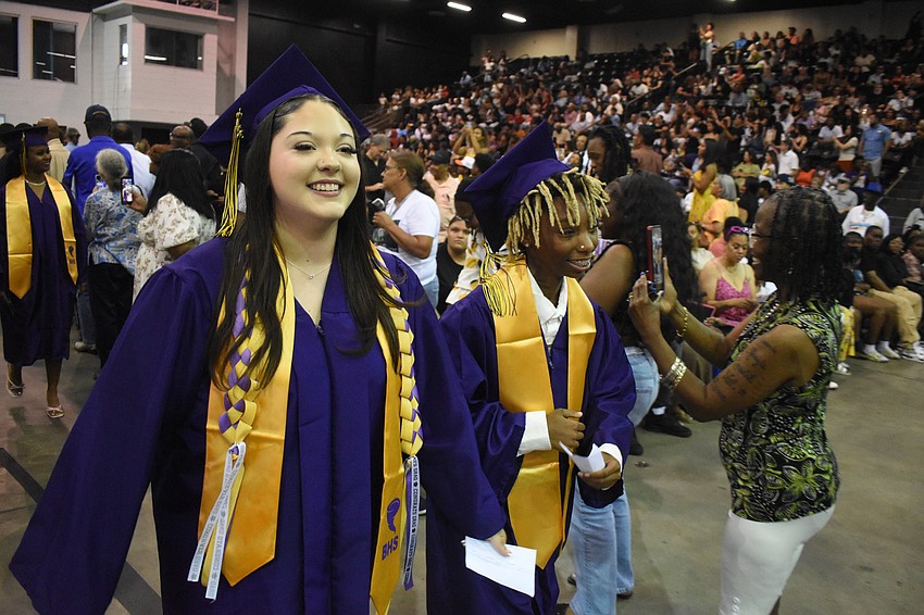 Mya Ricciardi and Makayla Whitehead walk towards the stage.