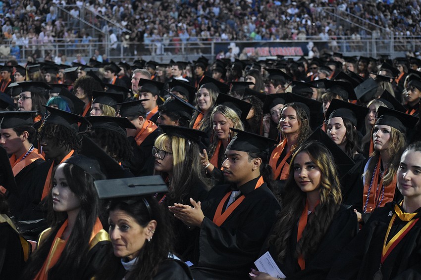 Students get seated in the stadium.