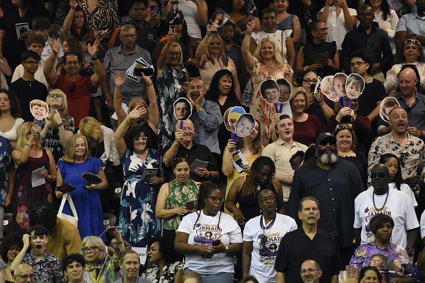 The crowd displays their enthusiasm as they are recognized from the podium.