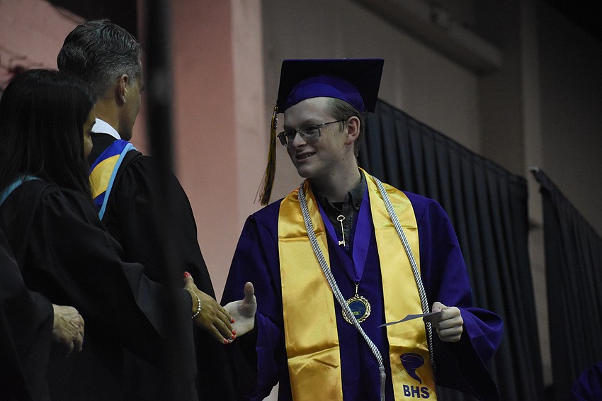 Superintendent of Schools Terry Connor greets Robert Heath.