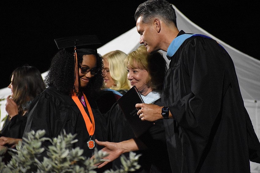 Miracle Farrior greets Superintendent of Schools Terry Connor