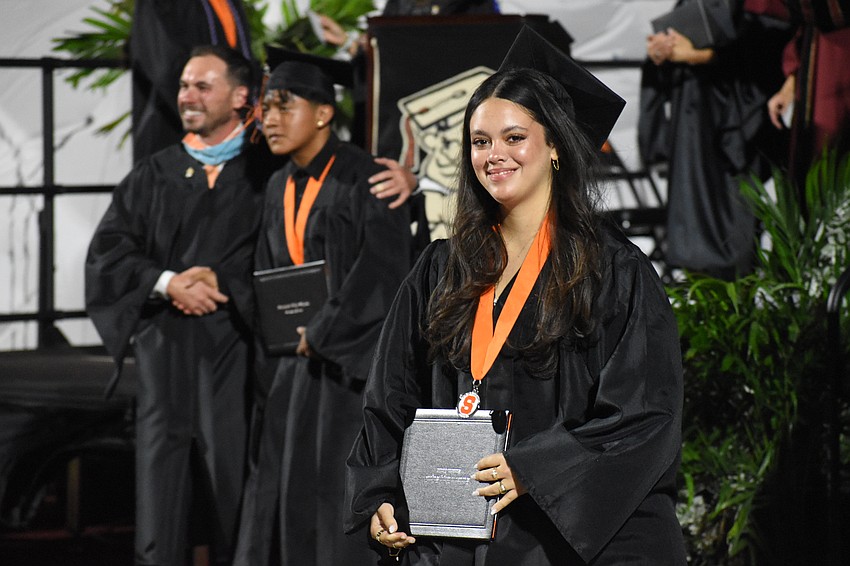 Sofia Garofalo Caraballo heads down from the stage with her diploma.