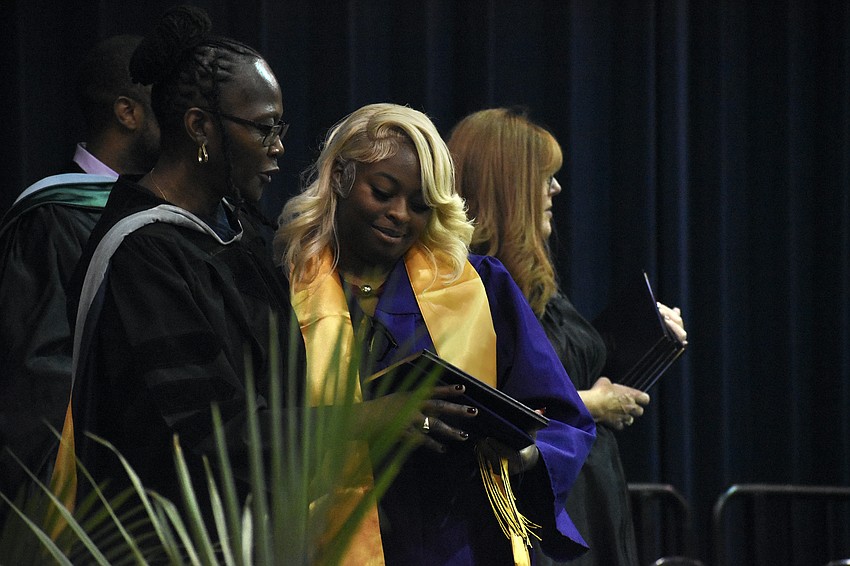 Principal Rachel Shelley greets Taliyah Renee Durn.