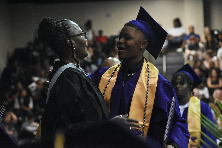 Principal Rachel Shelley greets Ta'jahnae Hawks.