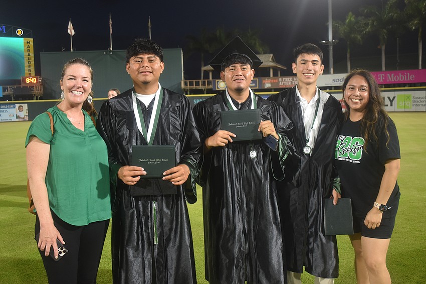 Dawn Haushalter, Robin Perez, Moises Perez, Anger Serrano and Avelina Besse of the English for Speakers of Other Languages program celebrate at the Lakewood Ranch High School graduation ceremony.