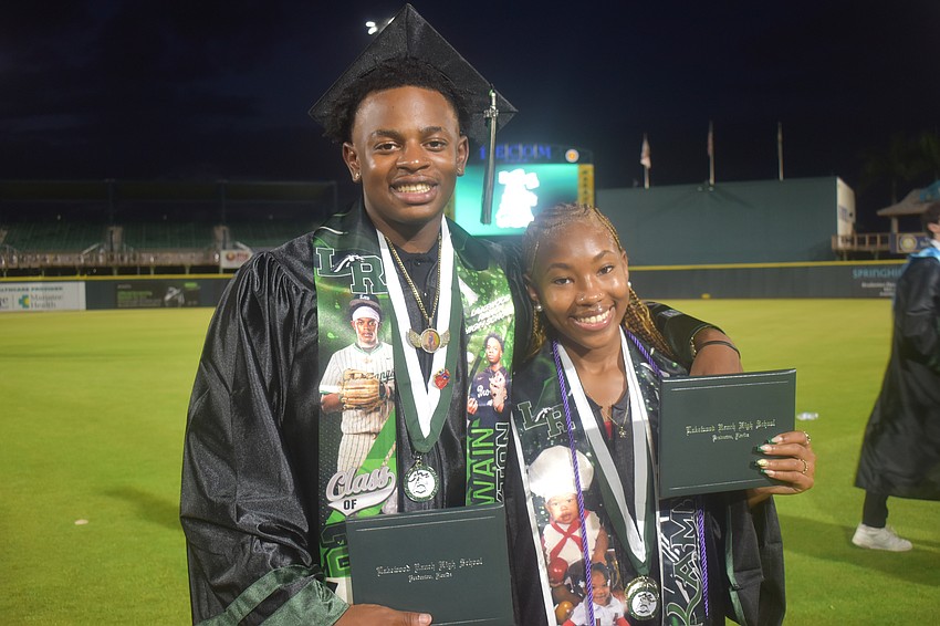 Kuwain Claxton and Ka’Mya Dunbar ordered custom stoles for graduation day which include pictures of themselves.