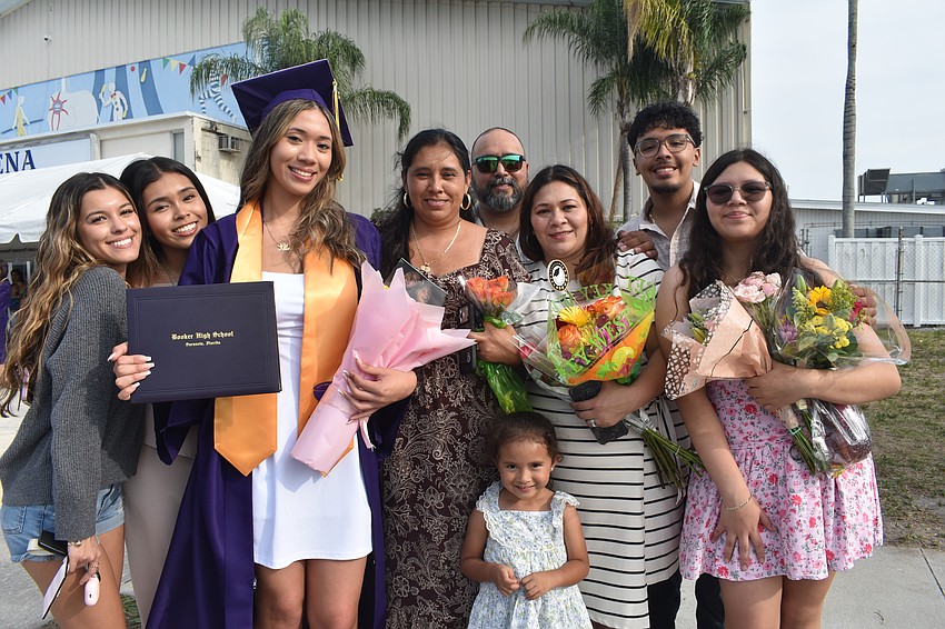 Graduate Alondra Lugo (third from left) celebrates with her friend Leah Ramlackhan, cousin Melany Rodriguez, cousins Gladys Marquez and Alice Rodriguez, parents Ivan Lugo and Gladys Marquez, and siblings Alex and Alexandra Lugo.