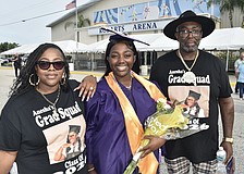 Anesha Green (center) celebrates with her mother, Shemere Green, and father, Cedric Green.