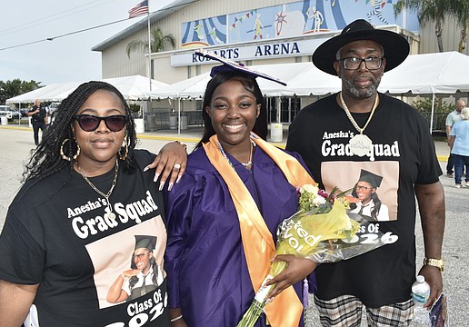 Anesha Green (center) celebrates with her mother, Shemere Green, and father, Cedric Green.