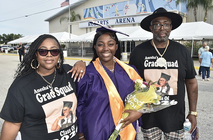 Anesha Green (center) celebrates with her mother, Shemere Green, and father, Cedric Green.