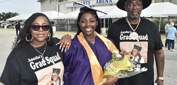 Anesha Green (center) celebrates with her mother, Shemere Green, and father, Cedric Green.