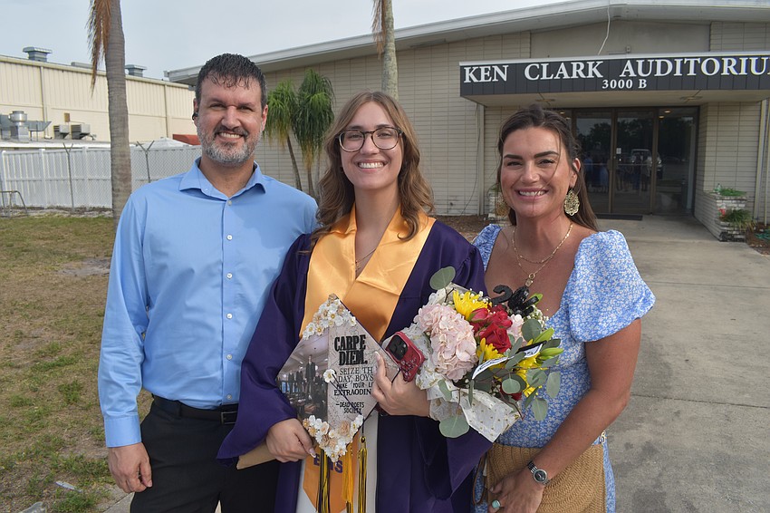 Graduate Savannah Kincaid (center) prepares to seize the day as she stands with her parents James Kincaid and Leah Braaten.