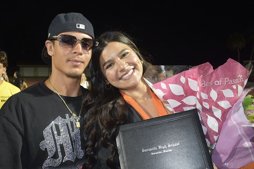 Julio Henrique and Julia Dos Santos celebrate graduation.